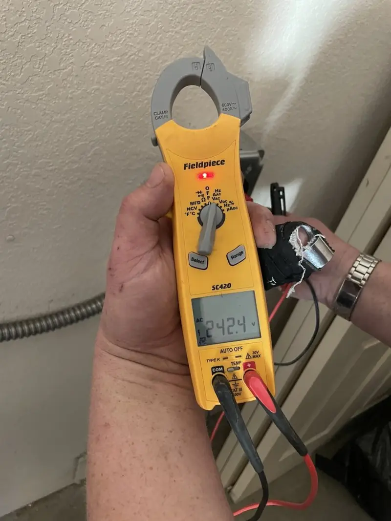 Voltage testing with clamp meter during Whole House Surge Protector in Ambridge